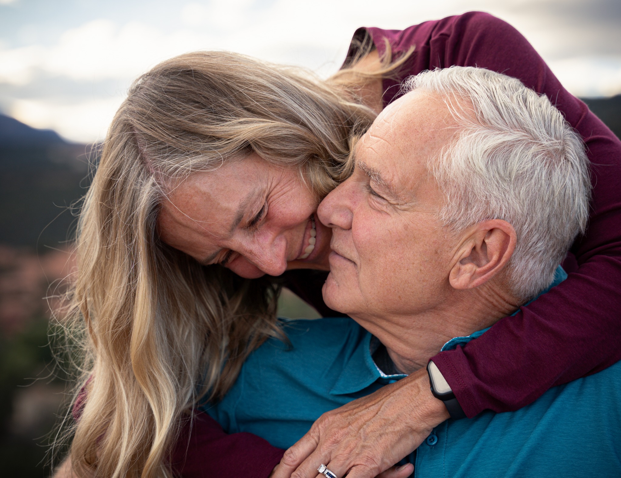 Close portrait of a couple embracing and smiling together