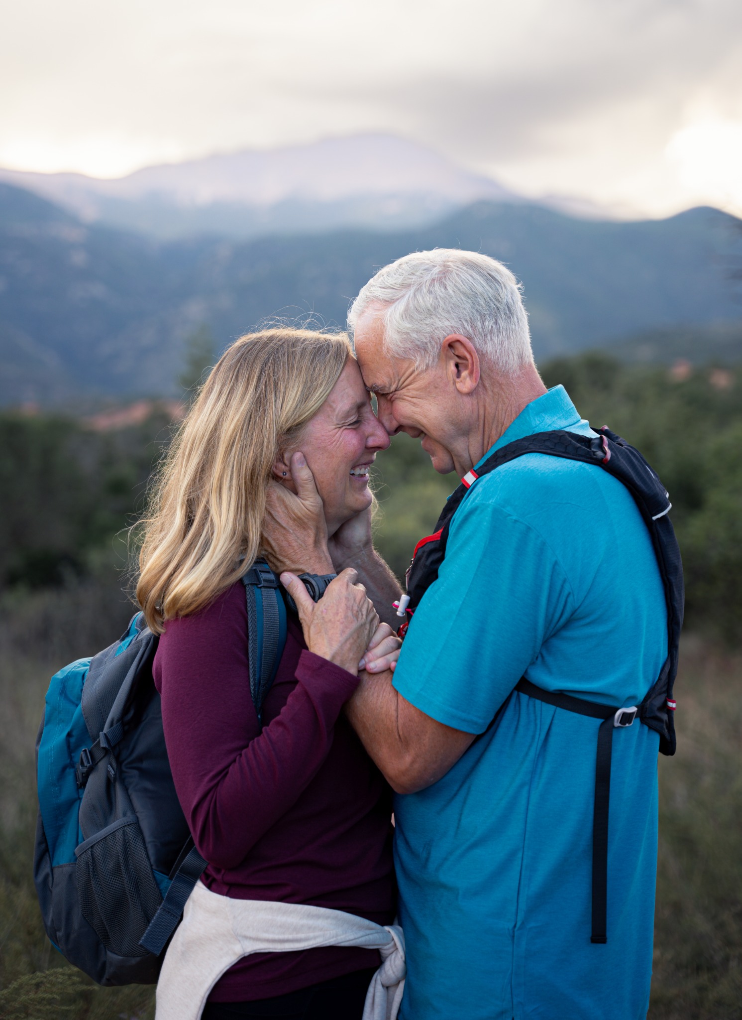A couple sharing a moment on a Colorado mountain trail