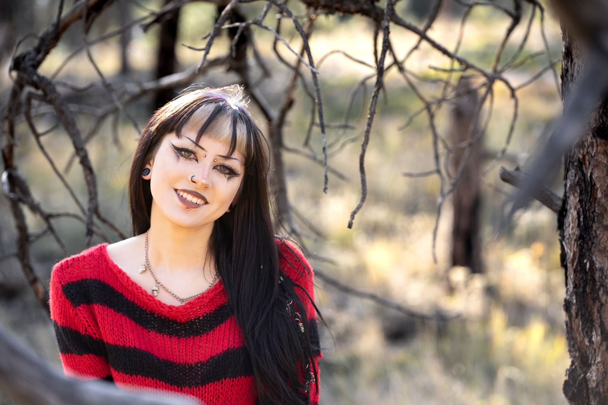 Senior portrait framed by Colorado woodland